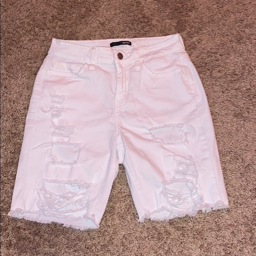 white ripped shorts